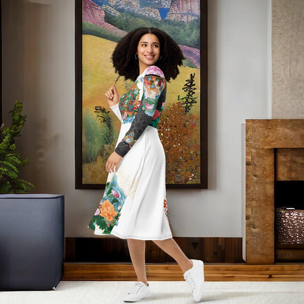 A woman in a Green Tara Thangka Midi Dress by Cosmovisions-AI standing in front of a painting.