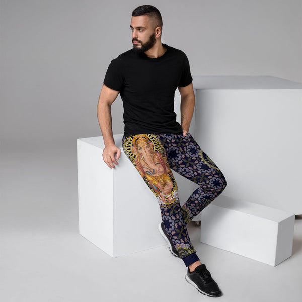 A man wearing a black t-shirt and Cosmovisions-AI M_joggers_AO_HIN_ganesh_V1.