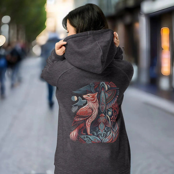 The back of a woman wearing a Sacred Animal Haida Eco Hoodie by Cosmovisions-AI with an image of a fox.